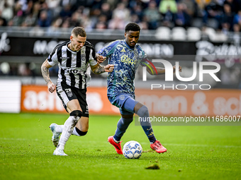 Heracles Almelo forward Suf Podgoreanu and AFC Ajax Amsterdam defender Jorrel Hato play during the match between Heracles Almelo and Ajax at...