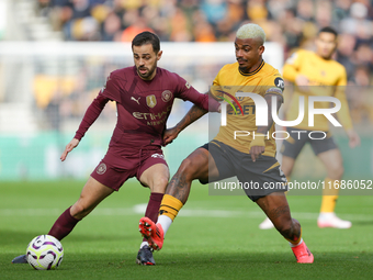 Mario Lemina of Wolves and Bernardo Silva of Manchester City are in action during the Premier League match between Wolverhampton Wanderers a...