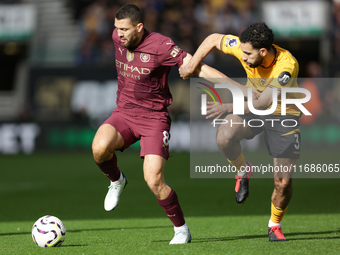 Mateo Kovacic of Manchester City and Rayan Ait-Nouri of Wolves are in action during the Premier League match between Wolverhampton Wanderers...