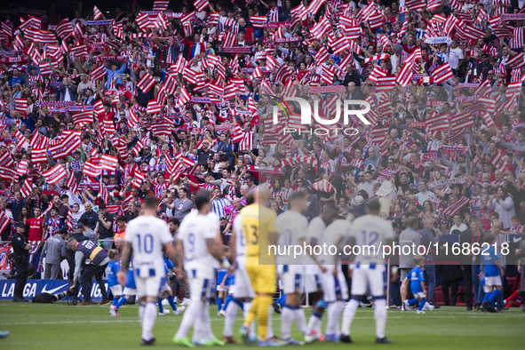 Atletico Madrid fans wave flags during the La Liga 2024/25 match between Atletico de Madrid and Leganes at Riyadh Air Metropolitano Stadium...