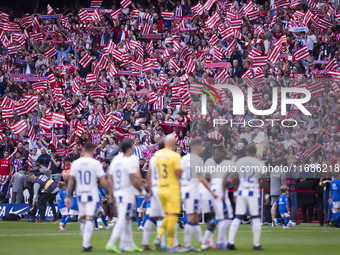 Atletico Madrid fans wave flags during the La Liga 2024/25 match between Atletico de Madrid and Leganes at Riyadh Air Metropolitano Stadium...