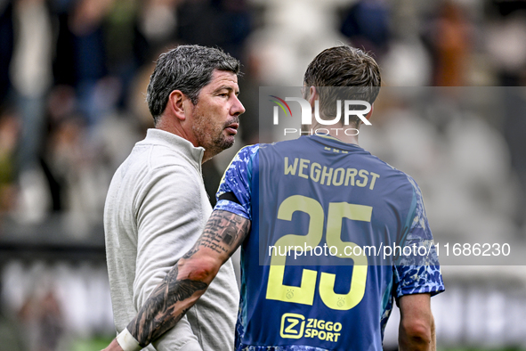 Heracles Almelo trainer Erwin van de Looi and AFC Ajax Amsterdam forward Wout Weghorst participate in the match between Heracles Almelo and...