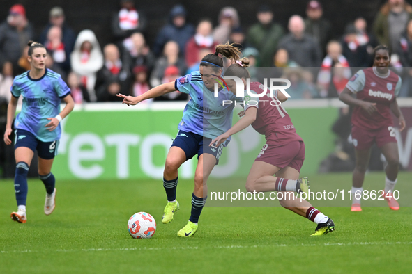 Mariona Caldentey (8 Arsenal) is challenged by Anouk Denton (18 West Ham) during the Barclays FA Women's Super League match between West Ham...