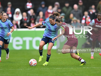 Mariona Caldentey (8 Arsenal) is challenged by Anouk Denton (18 West Ham) during the Barclays FA Women's Super League match between West Ham...