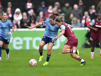 Mariona Caldentey (8 Arsenal) is challenged by Anouk Denton (18 West Ham) during the Barclays FA Women's Super League match between West Ham...