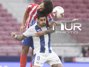 Axel Witsel of Atletico de Madrid and Miguel de la Fuente of Leganes fight for the ball during the La Liga 2024/25 match between Atletico de...