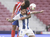 Axel Witsel of Atletico de Madrid and Miguel de la Fuente of Leganes fight for the ball during the La Liga 2024/25 match between Atletico de...