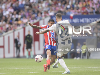 Angel Correa of Atletico de Madrid and Matija Nastasic of Leganes fight for the ball during the La Liga 2024/25 match between Atletico de Ma...