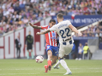 Angel Correa of Atletico de Madrid and Matija Nastasic of Leganes fight for the ball during the La Liga 2024/25 match between Atletico de Ma...