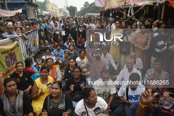 Citizens shout slogans while they attend the Junior Doctors hunger strike to protest the rape and murder case of a medic in a government-run...