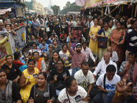 Citizens shout slogans while they attend the Junior Doctors hunger strike to protest the rape and murder case of a medic in a government-run...