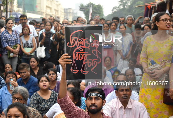 Citizens shout slogans while they attend the Junior Doctors hunger strike to protest the rape and murder case of a medic in a government-run...