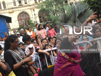 Citizens shout slogans while they attend the Junior Doctors hunger strike to protest the rape and murder case of a medic in a government-run...