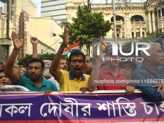 Citizens shout slogans while they attend the Junior Doctors hunger strike to protest the rape and murder case of a medic in a government-run...