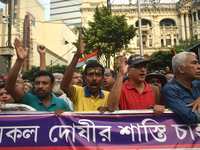 Citizens shout slogans while they attend the Junior Doctors hunger strike to protest the rape and murder case of a medic in a government-run...