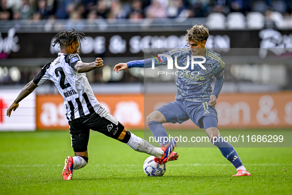 Heracles Almelo defender Mimeirhel Benita and AFC Ajax Amsterdam forward Mika Godts are present during the match between Heracles Almelo and...