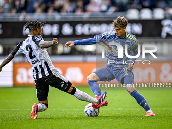 Heracles Almelo defender Mimeirhel Benita and AFC Ajax Amsterdam forward Mika Godts are present during the match between Heracles Almelo and...