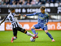 Heracles Almelo defender Mimeirhel Benita and AFC Ajax Amsterdam forward Mika Godts are present during the match between Heracles Almelo and...