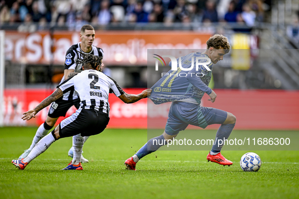 Heracles Almelo defender Mimeirhel Benita and AFC Ajax Amsterdam forward Mika Godts are present during the match between Heracles Almelo and...