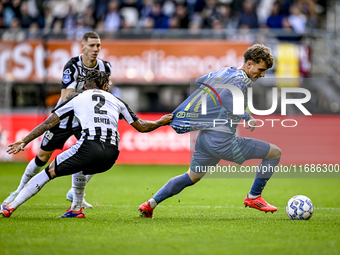 Heracles Almelo defender Mimeirhel Benita and AFC Ajax Amsterdam forward Mika Godts are present during the match between Heracles Almelo and...