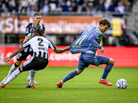 Heracles Almelo defender Mimeirhel Benita and AFC Ajax Amsterdam forward Mika Godts are present during the match between Heracles Almelo and...