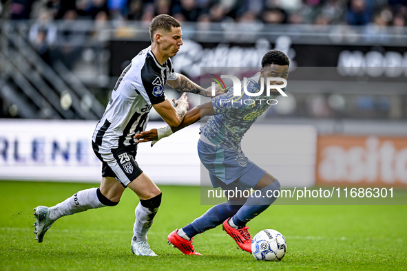 Heracles Almelo forward Suf Podgoreanu and AFC Ajax Amsterdam defender Jorrel Hato play during the match between Heracles Almelo and Ajax at...