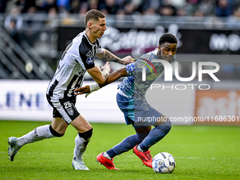 Heracles Almelo forward Suf Podgoreanu and AFC Ajax Amsterdam defender Jorrel Hato play during the match between Heracles Almelo and Ajax at...