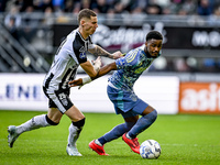 Heracles Almelo forward Suf Podgoreanu and AFC Ajax Amsterdam defender Jorrel Hato play during the match between Heracles Almelo and Ajax at...