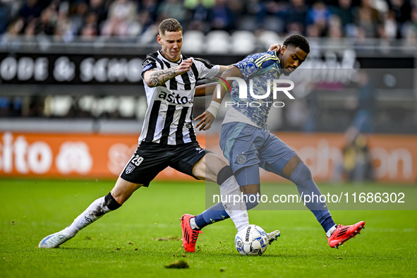 Heracles Almelo forward Suf Podgoreanu and AFC Ajax Amsterdam defender Jorrel Hato play during the match between Heracles Almelo and Ajax at...