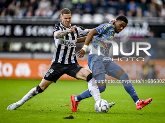 Heracles Almelo forward Suf Podgoreanu and AFC Ajax Amsterdam defender Jorrel Hato play during the match between Heracles Almelo and Ajax at...