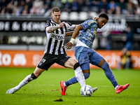 Heracles Almelo forward Suf Podgoreanu and AFC Ajax Amsterdam defender Jorrel Hato play during the match between Heracles Almelo and Ajax at...