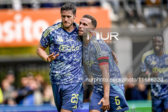 AFC Ajax Amsterdam forward Wout Weghorst and AFC Ajax Amsterdam midfielder Jordan Henderson celebrate the 2-3 goal during the match between...