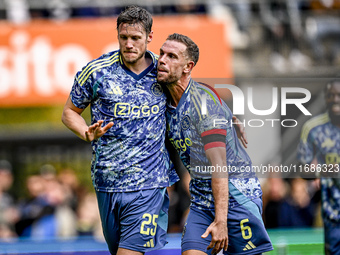 AFC Ajax Amsterdam forward Wout Weghorst and AFC Ajax Amsterdam midfielder Jordan Henderson celebrate the 2-3 goal during the match between...