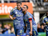 AFC Ajax Amsterdam forward Wout Weghorst and AFC Ajax Amsterdam midfielder Jordan Henderson celebrate the 2-3 goal during the match between...