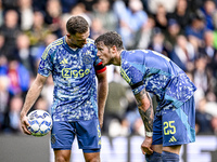 AFC Ajax Amsterdam midfielder Jordan Henderson and AFC Ajax Amsterdam forward Wout Weghorst discuss who takes the penalty during the match b...