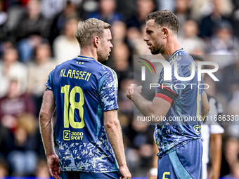 AFC Ajax Amsterdam midfielder Jordan Henderson and AFC Ajax Amsterdam midfielder Davy Klaassen discuss who takes the penalty during the matc...