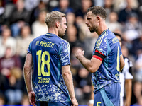 AFC Ajax Amsterdam midfielder Jordan Henderson and AFC Ajax Amsterdam midfielder Davy Klaassen discuss who takes the penalty during the matc...