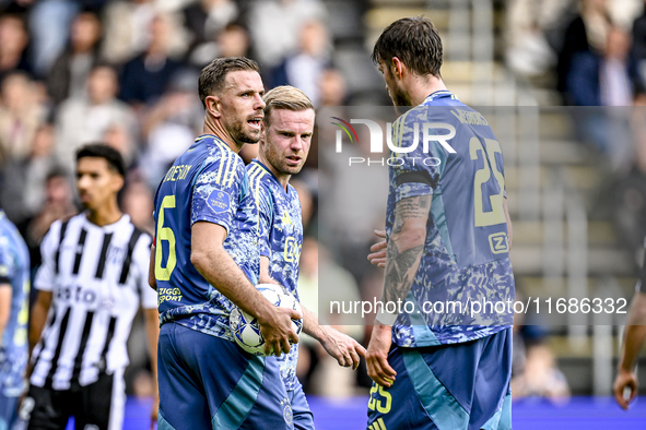 AFC Ajax Amsterdam midfielder Jordan Henderson, midfielder Davy Klaassen, and forward Wout Weghorst discuss who takes the penalty during the...