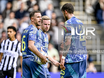 AFC Ajax Amsterdam midfielder Jordan Henderson, midfielder Davy Klaassen, and forward Wout Weghorst discuss who takes the penalty during the...