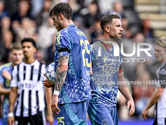 AFC Ajax Amsterdam midfielder Jordan Henderson gives the penalty to AFC Ajax Amsterdam forward Wout Weghorst during the match between Heracl...