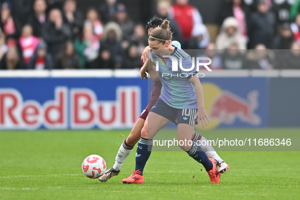 Kim Little (10 Arsenal) is challenged by Riko Ueki (9 West Ham) during the Barclays FA Women's Super League match between West Ham United an...