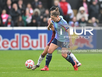 Kim Little (10 Arsenal) is challenged by Riko Ueki (9 West Ham) during the Barclays FA Women's Super League match between West Ham United an...