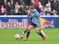 Kim Little (10 Arsenal) is challenged by Riko Ueki (9 West Ham) during the Barclays FA Women's Super League match between West Ham United an...