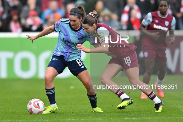 Mariona Caldentey (8 Arsenal) is challenged by Anouk Denton (18 West Ham) during the Barclays FA Women's Super League match between West Ham...