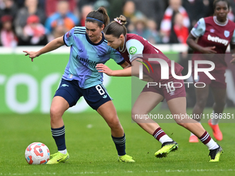 Mariona Caldentey (8 Arsenal) is challenged by Anouk Denton (18 West Ham) during the Barclays FA Women's Super League match between West Ham...