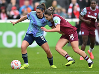 Mariona Caldentey (8 Arsenal) is challenged by Anouk Denton (18 West Ham) during the Barclays FA Women's Super League match between West Ham...