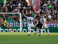 Gaetano Oristanio of Venezia competes against Marten De Roon of Atalanta during the Italian Serie A soccer championship match between Venezi...