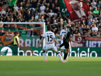 Gaetano Oristanio of Venezia competes against Marten De Roon of Atalanta during the Italian Serie A soccer championship match between Venezi...