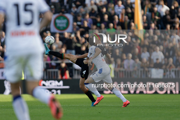 Jay Idzes of Venezia plays against Lazar Samardzic of Atalanta during the Italian Serie A soccer match between Venezia FC and Atalanta BC at...