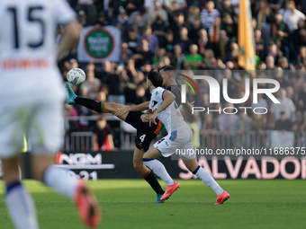 Jay Idzes of Venezia plays against Lazar Samardzic of Atalanta during the Italian Serie A soccer match between Venezia FC and Atalanta BC at...